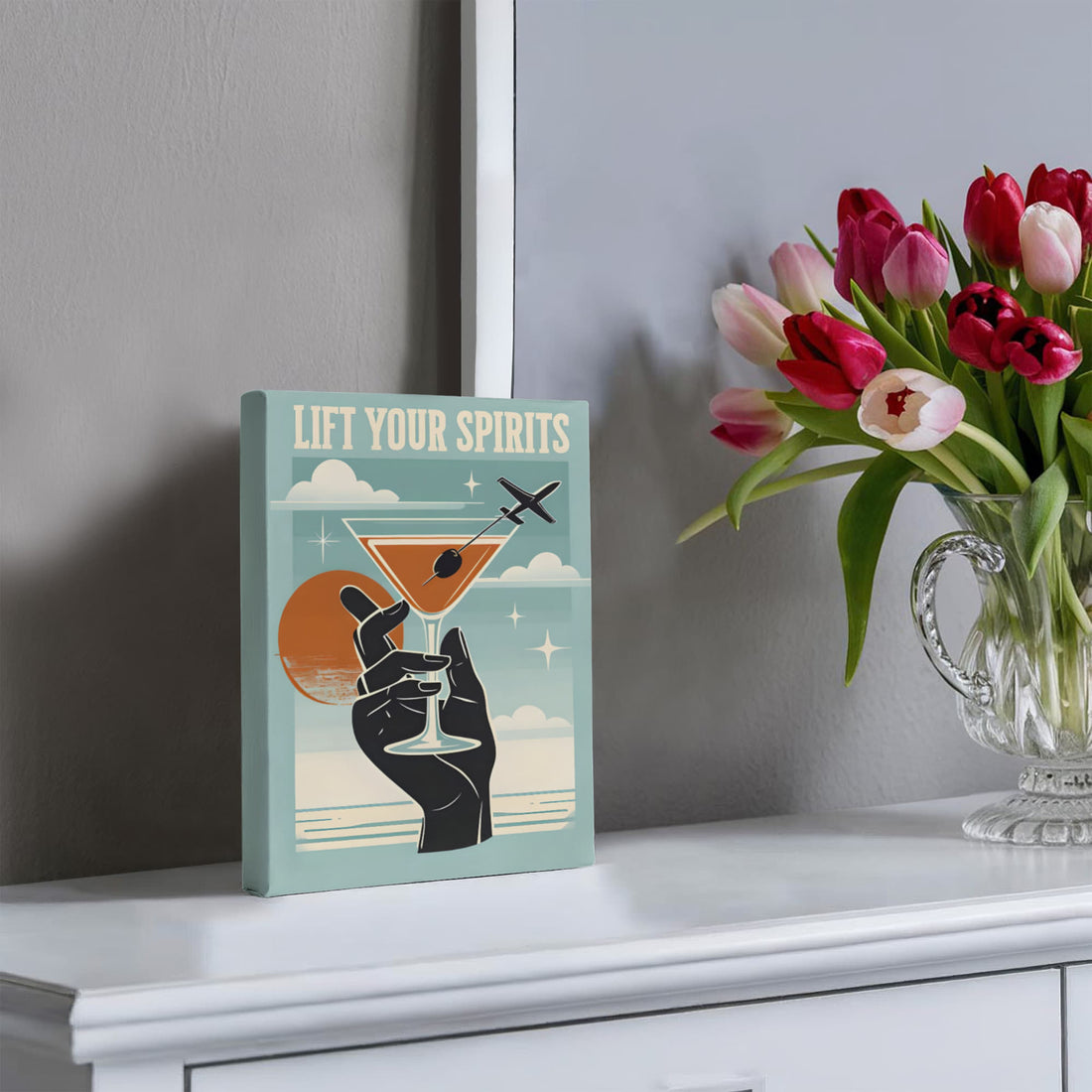 “Lift Your Spirits" Gallery Wrapped Canvas.” Perfect for adding a splash of sass and sophistication to any bar area, kitchen, or travel-lover's nook.