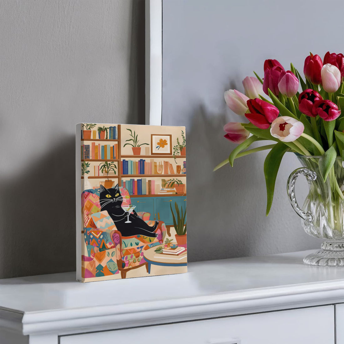A playful, artful Wrapped Canvas piece for book lovers, cat people, and cocktail connoisseurs like this lounging black cat knows how to unwind in style.