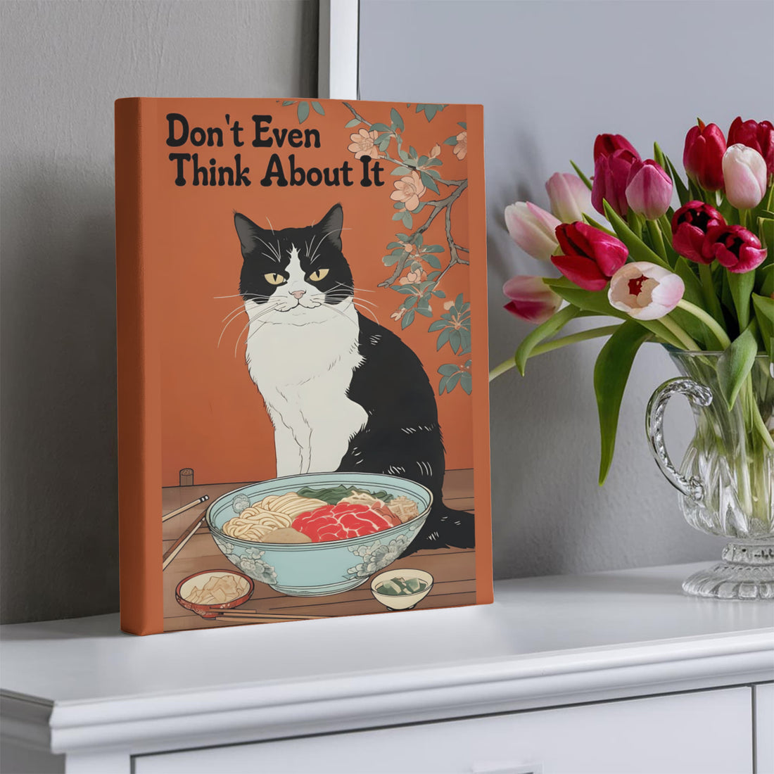 “Don't Even Think About It,” this canvas brings humor and personality no-nonsense tuxedo cat guarding its ramen bowl.